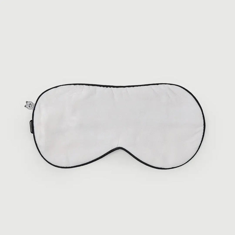 Antifaz blanco de bambú orgánico, diseñado para un descanso reparador y óptima comodidad. Ideal para bloquear la luz durante el sueño o la meditación.
